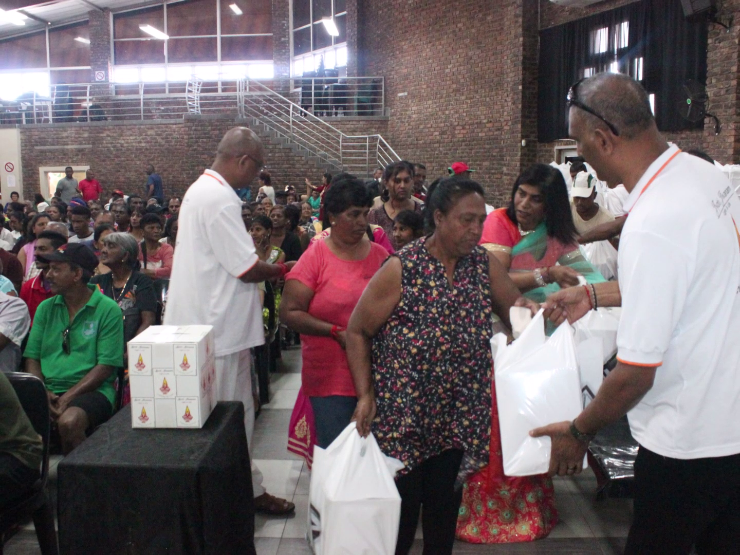 Jyoti Jivanam volunteers handing out food hampers to community members
