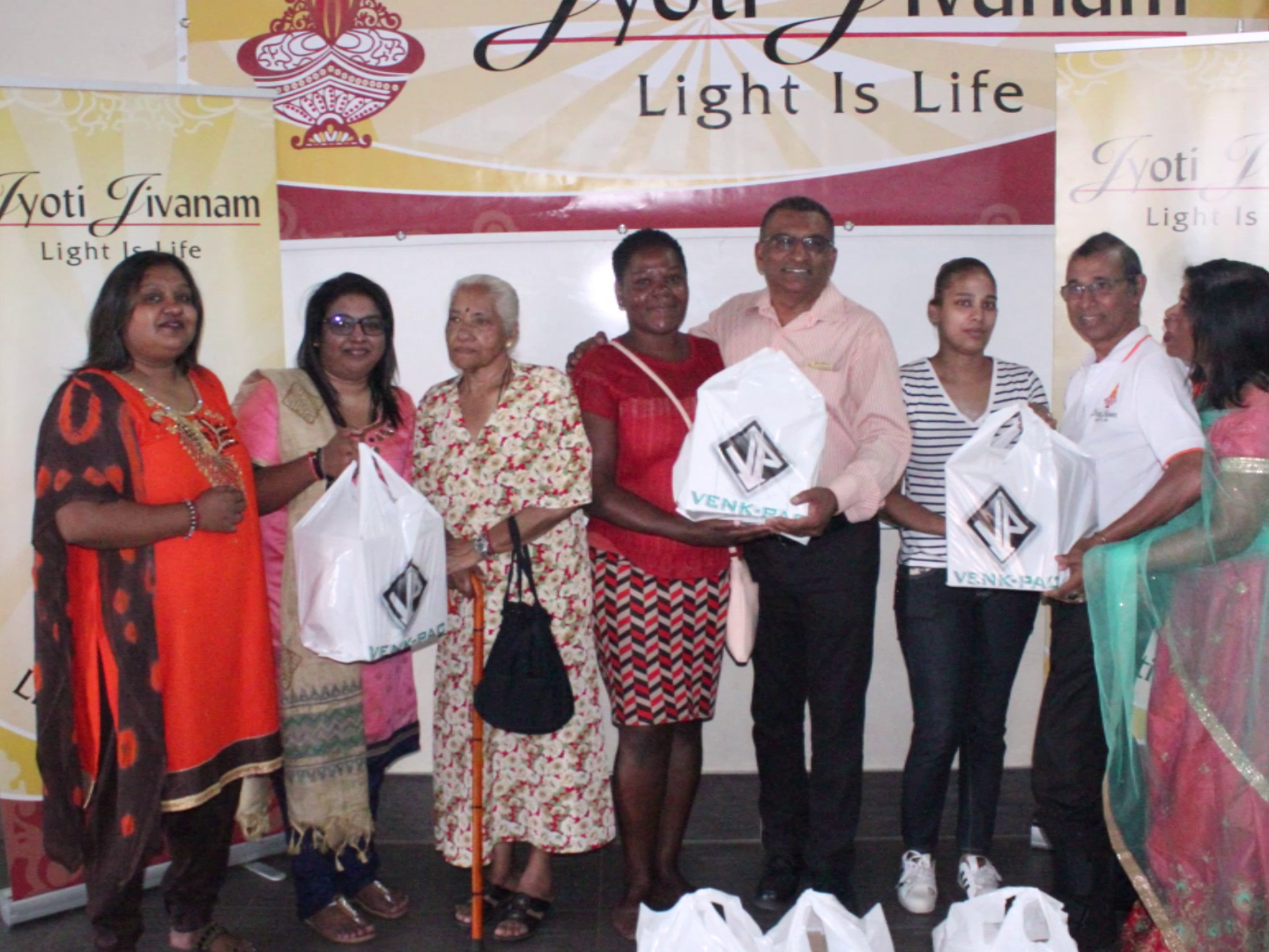 Jyoti Jivanam volunteers distributing food hampers under the movement banner